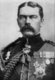 Kitchener won fame in 1898 for winning the Battle of Omdurman and securing control of the Sudan, after which he was given the title 'Lord Kitchener of Khartoum; as Chief of Staff (1900-02) in the second Boer war he played a key role in Lord Roberts' conquest of the Boer Republics, then succeeded Roberts as commander-in-chief - by which time Boer forces had taken to guerrilla fighting and British forces imprisoned Boer civilians in concentration camps. His term as Commander-in-Chief (1902-09) of the Army in India saw him quarrel with Viceroy Lord Curzon, who eventually resigned. Kitchener then returned to Egypt as British Agent and Consul-General (de facto Viceroy).<br/><br/>

In 1914, at the start of the First World War, Lord Kitchener became Secretary of State for War, a Cabinet Minister. One of the few men to foresee a long war, one in which Britain's victory was far from secure, he organised the largest volunteer army that Britain, and indeed the Empire, has seen and a significant expansion of materiels production to fight Germany on the Western Front. His commanding image, appearing on recruiting posters demanding 'Your Country Need You!', remains recognised and parodied in popular culture to this day. He died in 1916.